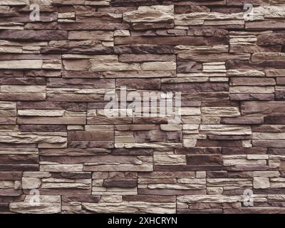 Dark beige and brown slate stone wall texture Stock Photo