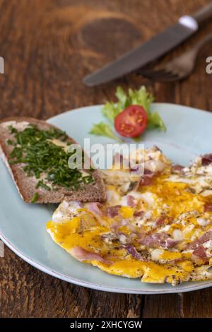 Scrambled eggs on a blue plate Stock Photo
