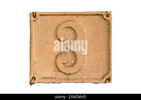Old retro weathered cast iron plate with number 3 isolated on white background Stock Photo