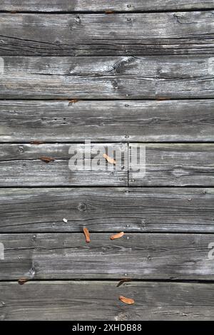 Closeup of outdoor patio deck showing weathered deck boards that have stood the test of time. Stock Photo