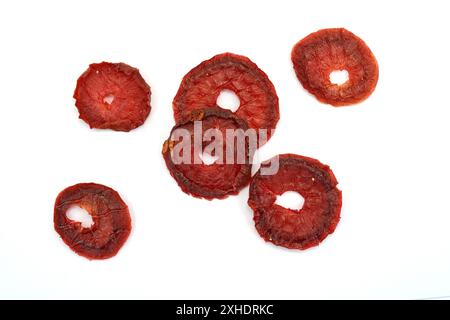 Dried red plums over white background Stock Photo