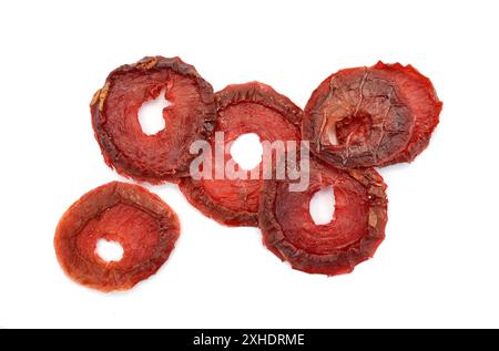 Dried red plums over white background Stock Photo