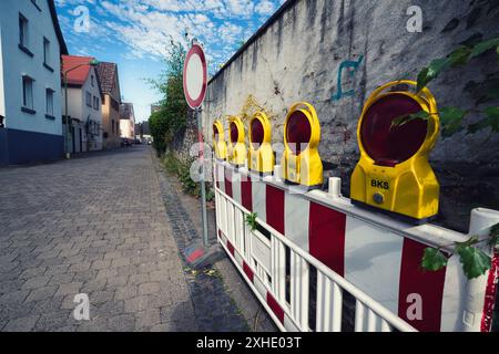 A Traffic Road barrier with red lights on a German street Stock Photo