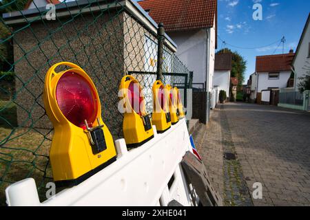 A Traffic Road barrier with red lights on a German street Stock Photo
