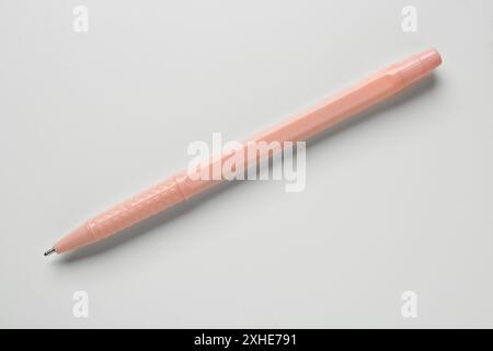 Pink ballpoint pen on white background Stock Photo