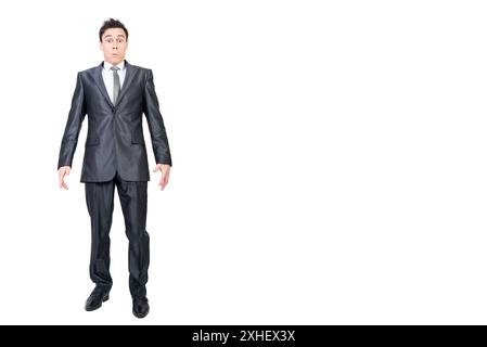 Surprised male employee looking at camera in white studio Stock Photo