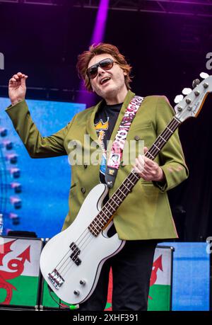 Leeds, UK. 13th July, 2024. Bassist of the Welsh rock band The Manic Street Preachers, Nicky Wire, playing live in Millennium Square in the centre of the city. Credit: ernesto rogata/Alamy Live News Stock Photo