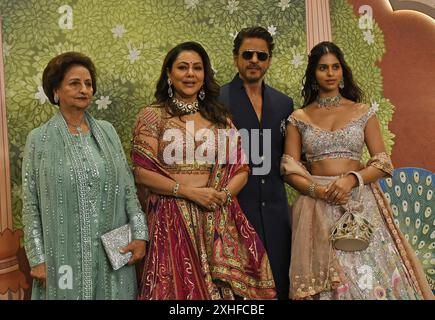 Mumbai, India. 13th July, 2024. L-R Savita Chhibber (mother of Gauri Khan), Indian film producer and fashion designer Gauri Khan, Bollywood actor Shahrukh Khan and Suhana Khan (daughter of Shahrukh Khan and Gauri Khan) pose for a photo on the red carpet during the blessings ceremony of the newly married couple Anant Ambani and Radhika Merchant in Mumbai. Credit: SOPA Images Limited/Alamy Live News Stock Photo