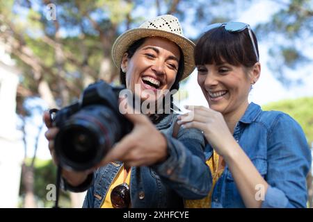 two best friends taking photos while travelling Stock Photo