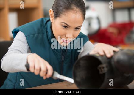 happy female working with special tool at workplace Stock Photo