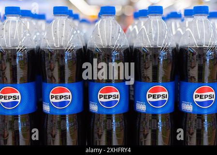 Rows of plastic bottles with Pepsi on March 5, 2024, in Bangkok, Thailand. Stock Photo