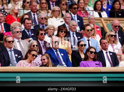 The Princess of Wales, Pippa Middleton, Princess Charlotte, Tom Cruise, Christopher McQuarrie, Benedict Cumberbatch, Sophie Hunter and Julia Roberts in the royal box on day fourteen of the 2024 Wimbledon Championships at the All England Lawn Tennis and Croquet Club, London. Picture date: Sunday July 14, 2024. Stock Photo