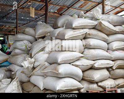 Stacking of big white bags in the modern warehouse Stock Photo