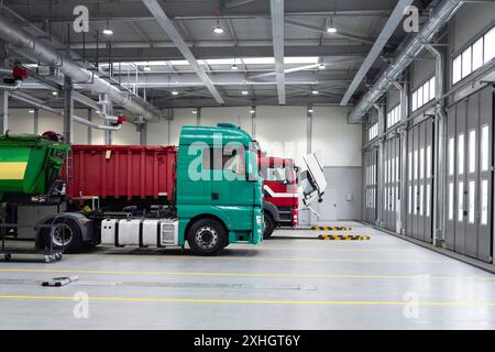 Trucks being repaired in a larger garage. Service maintenance of trucks and cars, diagnostics, car service. Stock Photo