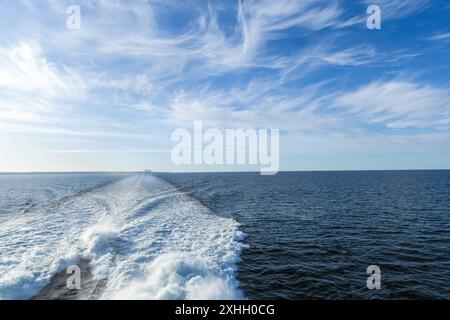 Water trail behind cruise ship. Summer travel concept. High quality photo Stock Photo