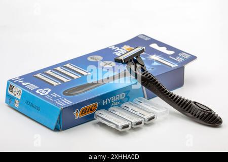 Kyiv, Ukraine - March 29, 2024: Studio shoot of Bic Hybrid Flex shaving razors machine with replaceable cassette blades closeup on white. Bic produces Stock Photo