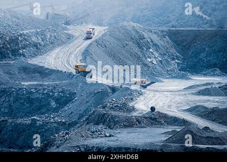 Active diabase quarry with trucks and conveyor belts. Parekklisia, Cyprus Stock Photo