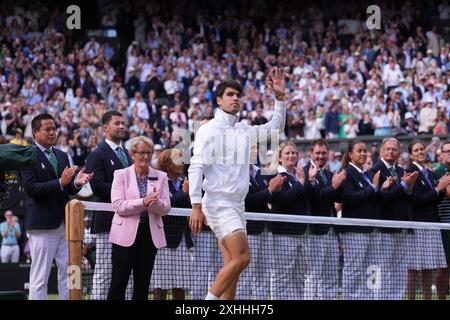 LONDON, ENGLAND - JULY 14: Catherine Princess of Wales presents the winner's trophy to Spain's Carlos Alcaraz (L) after beating Serbia's Novak Djokovic during their men's singles final tennis match on day fourteen of the Wimbledon Tennis Championships at the All England Lawn Tennis and Croquet Club on July 14, 2024 in London, England Credit: MB Media Solutions/Alamy Live News Stock Photo