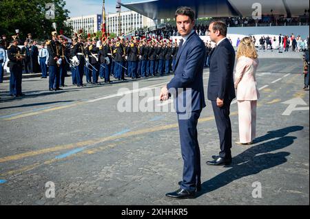 Paris, France. 14th July, 2024. French Prime Minister Gabriel Attal, French Armies Minister Sebastien Lecornu and French Secretary of State for Veterans and Memory Patricia Miralles attending the Bastille Day parade along the Avenue Foch at place Marechal de Lattre de Tassigny, in Paris, France on July 14, 2024. Photo by Eric Tschaen/Pool/ABACAPRESS.COM Credit: Abaca Press/Alamy Live News Stock Photo