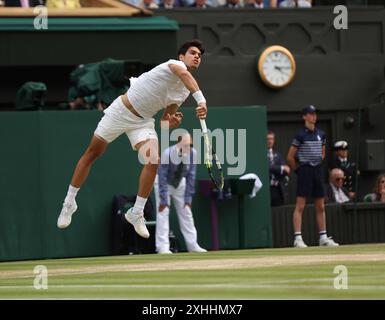 London, UK. 14th July, 2024. Carlos Alcaraz servesin his Men's Final match against Novak Djokovic at the 2024 Wimbledon Championships in London on Sunday, July 14, 2024. Alcaraz won 6-2, 6-2, 6-4. Photo by Hugo Philpott/UPI Credit: UPI/Alamy Live News Stock Photo