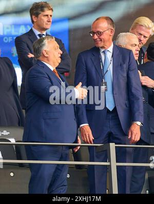 Berlin, Germany. 14th July, 2024. Viktor ORBAN, Hungarian President, Prime Minister of Hungary, Friedrich Merzin the final match SPAIN - ENGLAND of the UEFA European Championships 2024 on Jul 14, 2024 in Berlin, Germany. Photographer: ddp images/star-images Credit: ddp media GmbH/Alamy Live News Stock Photo