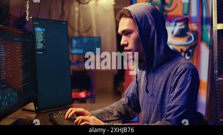 Hacker excited after finally developing zero day exploit undetectable by antivirus software installed on systems. Rogue programmer happy to successfully trick firewalls, close up Stock Photo