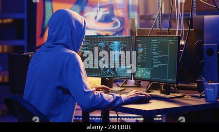 International spy using VPN and darknet as anonymity tools to mask his online identity while stealing governmental secrets. Man in underground bunker masking his location, committing espionage acts Stock Photo