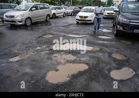 Mumbai, India. 14th July, 2024. MUMBAI, INDIA - JULY 14: Potholes on the road at Pumping station, Bhandup, on July 14, 2024 in Mumbai, India. (Photo by Satish Bate/Hindustan Times/Sipa USA ) Credit: Sipa USA/Alamy Live News Stock Photo