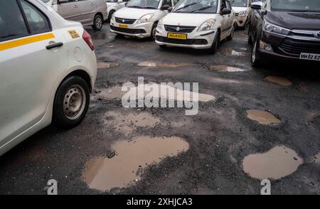 Mumbai, India. 14th July, 2024. MUMBAI, INDIA - JULY 14: Potholes on the road at Pumping station, Bhandup, on July 14, 2024 in Mumbai, India. (Photo by Satish Bate/Hindustan Times/Sipa USA ) Credit: Sipa USA/Alamy Live News Stock Photo