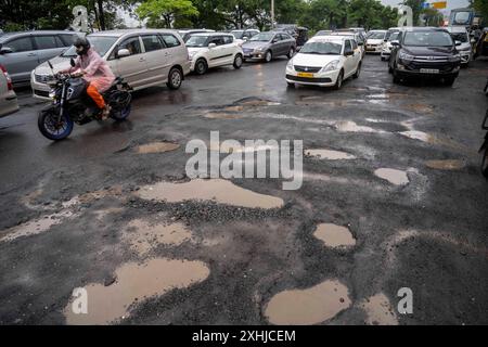 Mumbai, India. 14th July, 2024. MUMBAI, INDIA - JULY 14: Potholes on the road at Pumping station, Bhandup, on July 14, 2024 in Mumbai, India. (Photo by Satish Bate/Hindustan Times/Sipa USA ) Credit: Sipa USA/Alamy Live News Stock Photo