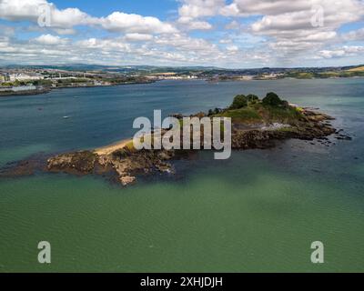 Aerial view of Drake's Island in Plymouth Sound, England with the city in the background and a partly cloudy sky Stock Photo