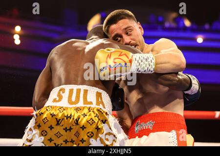 July 13, 2024: (L-R) Sulaiman Segawa punches Ruben Villa during their ...