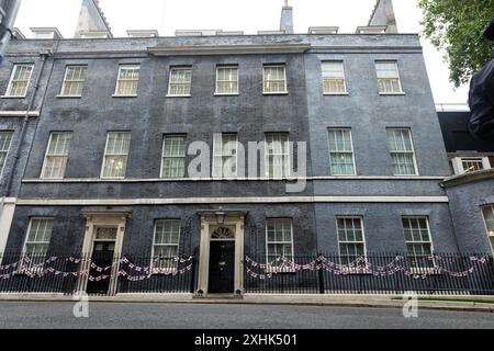 London, UK. 09th July, 2024. St George's flags and bunting adorn the outside 10 Downing Street, ahead of the England Football Team's participation in the Euro 2024 semi finals. Credit: SOPA Images Limited/Alamy Live News Stock Photo