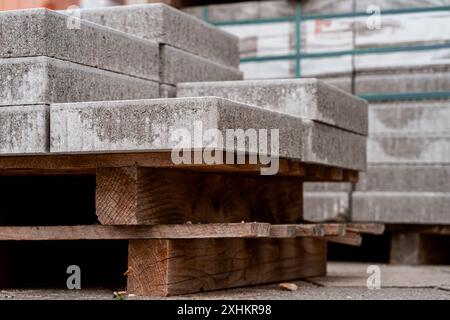 Stone slabs for road repairs stacked on a wooden pallet Stock Photo