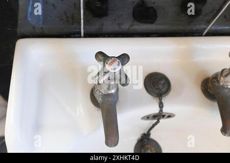 France, Alpes Maritimes, Roquebrune Cap Martin, modern faucet in black and white bathroom Stock Photo