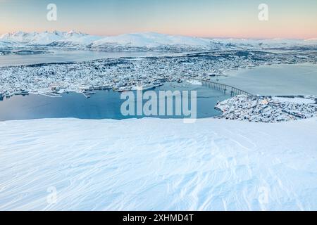 Arctic city of Tromso covered with snow at sunset, Norway Stock Photo