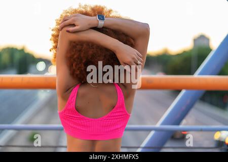 sporty woman stretching before starting to run Stock Photo