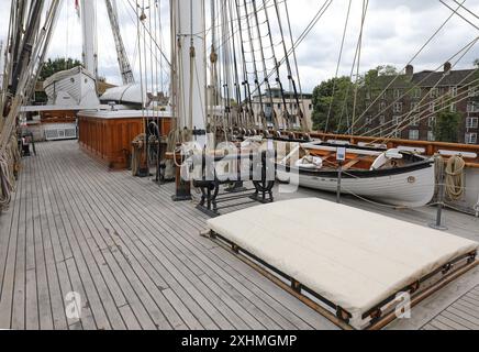 Top deck of the Cutty Sark, the famous sailing ship at Geenwich, London, UK. Shows ropes, rigging, masts and life boats. Stock Photo