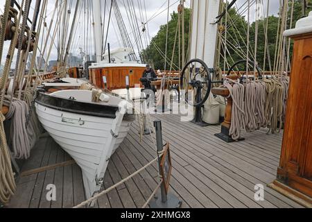 Top deck of the Cutty Sark, the famous sailing ship at Geenwich, London, UK. Shows ropes, rigging, masts and life boats. Stock Photo