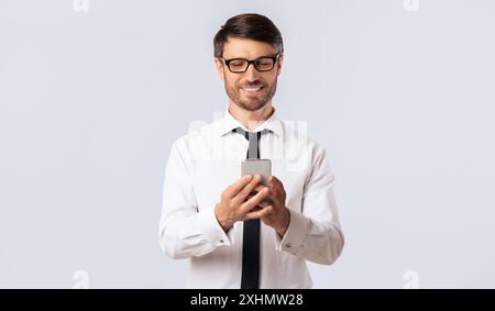 Smiling Man Using Smartphone Stock Photo