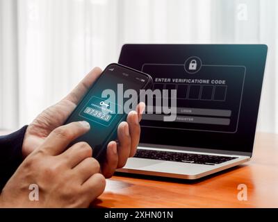 Two factor authentication or 2FA, cyber security concept. Password numbers with key icon for verification code on mobile smartphone screen holding by Stock Photo