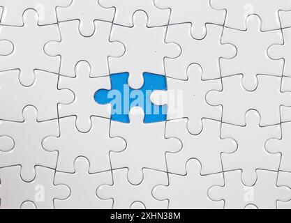Jigsaw puzzle with one piece missing Stock Photo
