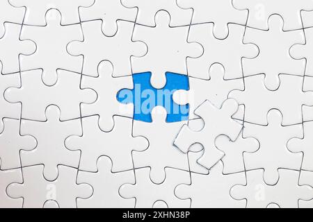 Jigsaw puzzle with one piece missing Stock Photo