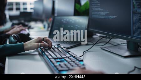Close Up of a Software Developer Working on a Desktop Computer, Implementing New Features and Updates to a Company Server. Stylish Specialist Wearing Rings and Bracelet, Typing on Keyboard Stock Photo