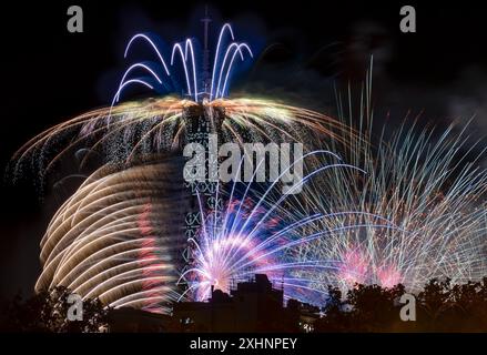 Paris, France - 07 14 2024: July 14 fireworks fired from The Eiffel Tower in Paris Stock Photo