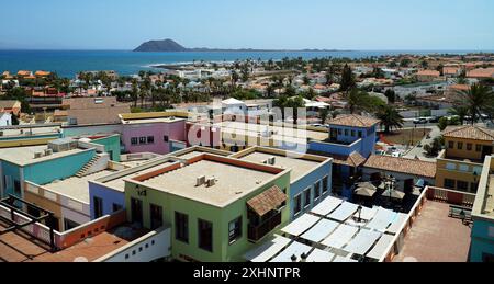 View over roof tops at Corralejo Fuerteventura looking toward Lobos Island Stock Photo