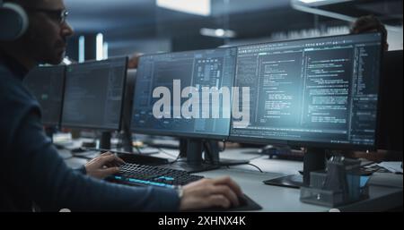 Close Up of a Software Developer Working on a Desktop Computer, Implementing New Features and Updates to a Company Server. Stylish Specialist Typing on Keyboard Stock Photo