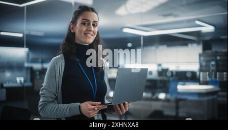 Portrait of a Young Attractive Empowered Multiethnic Woman Looking at Camera and Charmingly Smiling. Specialist at Work, Information Technology Manager, Software Engineering Professional Stock Photo