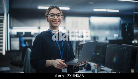 Portrait of an Attractive Empowered Multiethnic Woman Looking at Camera and Charmingly Smiling. Businesswoman at Work, Information Technology Manager, Software Engineering Professional Stock Photo