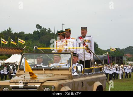 Bandar Seri Begawan, Brunei. 15th July, 2024. Brunei's Sultan Haji Hassanal Bolkiah inspects a traditional Grand Parade held for his 78th birthday in Bandar Seri Begawan, capital of Brunei, July 15, 2024. Brunei held the traditional Grand Parade on Monday, which will set off a series of events to celebrate the 78th birthday of Brunei's Sultan Haji Hassanal Bolkiah. Credit: Jeffrey Wong/Xinhua/Alamy Live News Stock Photo